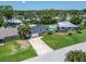 Aerial view of home with an expansive lawn and backyard pool at 4518 Helena Ne St, St Petersburg, FL 33703
