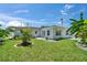 Backyard features a well-maintained lawn and white exterior at 4518 Helena Ne St, St Petersburg, FL 33703