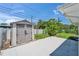Spacious backyard featuring a shed, lush greenery, and patio at 4518 Helena Ne St, St Petersburg, FL 33703