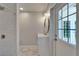 Updated bathroom with subway tile shower, white vanity, and glass-paneled exterior door at 4518 Helena Ne St, St Petersburg, FL 33703