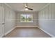 Bright bedroom features a ceiling fan and a window with a view of the outdoors at 4518 Helena Ne St, St Petersburg, FL 33703