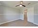 Bright bedroom features a ceiling fan and a door to another room at 4518 Helena Ne St, St Petersburg, FL 33703
