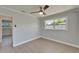 Bedroom features hardwood flooring, neutral walls, and view to another room at 4518 Helena Ne St, St Petersburg, FL 33703