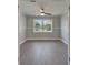 Bedroom with neutral paint, modern fan, and large picture window at 4518 Helena Ne St, St Petersburg, FL 33703
