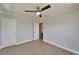 Bedroom features hardwood flooring and access to another room at 4518 Helena Ne St, St Petersburg, FL 33703