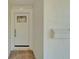 Up close front exterior white door with glass features on a house with stone porch at 4518 Helena Ne St, St Petersburg, FL 33703