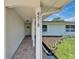 Front porch view of house number with decorative stone walkway and lush landscaping at 4518 Helena Ne St, St Petersburg, FL 33703