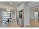 Bright eat-in kitchen features white cabinetry and stainless refrigerator at 4518 Helena Ne St, St Petersburg, FL 33703