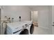 Laundry room featuring a modern washer and dryer, and a door to another room at 4518 Helena Ne St, St Petersburg, FL 33703