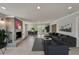 Open-concept living room with hardwood floors, fireplace, and access to dining and sitting areas at 4518 Helena Ne St, St Petersburg, FL 33703