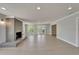 Open living space features a tiled fireplace, French doors, and access to other rooms at 4518 Helena Ne St, St Petersburg, FL 33703