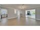 Spacious living space offering wood floors and an open floor plan with easy access to the kitchen at 4518 Helena Ne St, St Petersburg, FL 33703