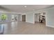 Open living space features French doors, wood floors, and convenient access to the kitchen at 4518 Helena Ne St, St Petersburg, FL 33703
