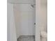 Modern shower features sleek subway tile and contrasting mosaic tile flooring in bath at 4518 Helena Ne St, St Petersburg, FL 33703