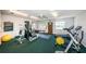 Home gym features fitness equipment, ceiling fan, and natural light, making it a great space for maintaining an active lifestyle at 4580 Overlook Ne Dr # 191, St Petersburg, FL 33703