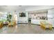Inviting living room area with comfortable seating, a large TV, and an open layout that connects to the kitchen and dining spaces at 4580 Overlook Ne Dr # 191, St Petersburg, FL 33703