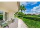 Private patio overlooks the lake and lush landscaping with patio furniture for outdoor relaxation at 4580 Overlook Ne Dr # 191, St Petersburg, FL 33703