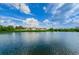 Scenic water view of complex with lush trees and vibrant blue sky at 4580 Overlook Ne Dr # 191, St Petersburg, FL 33703