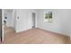 Clean bedroom with hardwood flooring, large windows, and ample space at 4753 58Th N St, Kenneth City, FL 33709