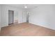 Clean, spacious bedroom features hardwood flooring, closet, and neutral color palette at 4753 58Th N St, Kenneth City, FL 33709