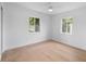 Bright bedroom with hardwood flooring and large windows offering natural light at 4753 58Th N St, Kenneth City, FL 33709