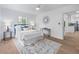 Bright bedroom with hardwood flooring, updated decor, and ample natural light at 4753 58Th N St, Kenneth City, FL 33709