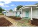 This home has colorful shutters, a white facade, and a welcoming entryway at 4753 58Th N St, Kenneth City, FL 33709