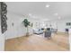 Bright living room features light wood floors, fireplace, and ample natural light at 4753 58Th N St, Kenneth City, FL 33709