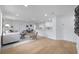 Open-concept living area with wood floors flows into the kitchen, creating an inviting space at 4753 58Th N St, Kenneth City, FL 33709