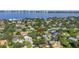 An aerial shot of the home site with Tampa Bay in the background, showcasing neighborhood greenery at 489 W Davis Blvd, Tampa, FL 33606