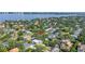 An aerial shot of the home site featuring surrounding neighborhood with lush greenery at 489 W Davis Blvd, Tampa, FL 33606
