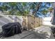Outdoor patio with grill, storage cabinets, and ladder at 489 W Davis Blvd, Tampa, FL 33606