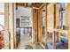 Under-renovation bathroom showing open walls and pipes leading to the window at 489 W Davis Blvd, Tampa, FL 33606