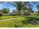Charming home featuring an expansive lawn, secure fencing, and lush, mature landscaping at 489 W Davis Blvd, Tampa, FL 33606