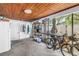 Well-organized garage space with wooden ceiling, storage shelves and two bicycles at 489 W Davis Blvd, Tampa, FL 33606