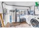 Functional laundry room with modern appliances, tiled floor and outdoor views at 489 W Davis Blvd, Tampa, FL 33606
