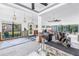 Spacious, bright living room featuring ceiling fans and windows overlooking a nice backyard at 489 W Davis Blvd, Tampa, FL 33606