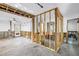 Bright and airy living room under renovation with natural light and door access at 489 W Davis Blvd, Tampa, FL 33606