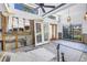 Spacious living room area with open ceilings, exposed brick, and bright windows at 489 W Davis Blvd, Tampa, FL 33606