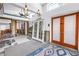 Open living room space with exposed interior framing, a ceiling fan and unique lighting fixtures at 489 W Davis Blvd, Tampa, FL 33606