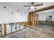 Spacious living room featuring wooden framework and ceiling fan at 489 W Davis Blvd, Tampa, FL 33606