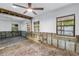 Room with exposed block walls and exposed ceiling framing with a view to the outside at 489 W Davis Blvd, Tampa, FL 33606