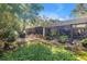 Spacious screened porch with lots of sunlight, surrounded by lush greenery and offering a tranquil retreat at 489 W Davis Blvd, Tampa, FL 33606