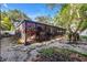 Large screened in porch surrounded by natural landscaping, provides an excellent outdoor living space at 489 W Davis Blvd, Tampa, FL 33606