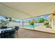 Relaxing backyard featuring a sparkling pool, covered patio area, and ample seating for outdoor enjoyment at 4906 N Arrawana Ave, Tampa, FL 33614