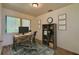 Bright home office with a large window, modern desk, and ample storage, ideal for productivity at 4906 N Arrawana Ave, Tampa, FL 33614
