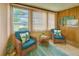 Inviting sunroom featuring comfortable seating and bright natural light, creating a relaxing atmosphere at 4906 N Arrawana Ave, Tampa, FL 33614