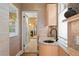 Charming bathroom with marble countertop, unique sink, and access to the walk-in closet at 501 Brightwaters Ne Blvd, St Petersburg, FL 33704