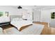 Light-filled bedroom featuring a king bed and two side tables at 501 Brightwaters Ne Blvd, St Petersburg, FL 33704