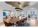 Expansive dining room featuring modern lighting, stylish chairs, and seamless flow to living areas at 501 Brightwaters Ne Blvd, St Petersburg, FL 33704